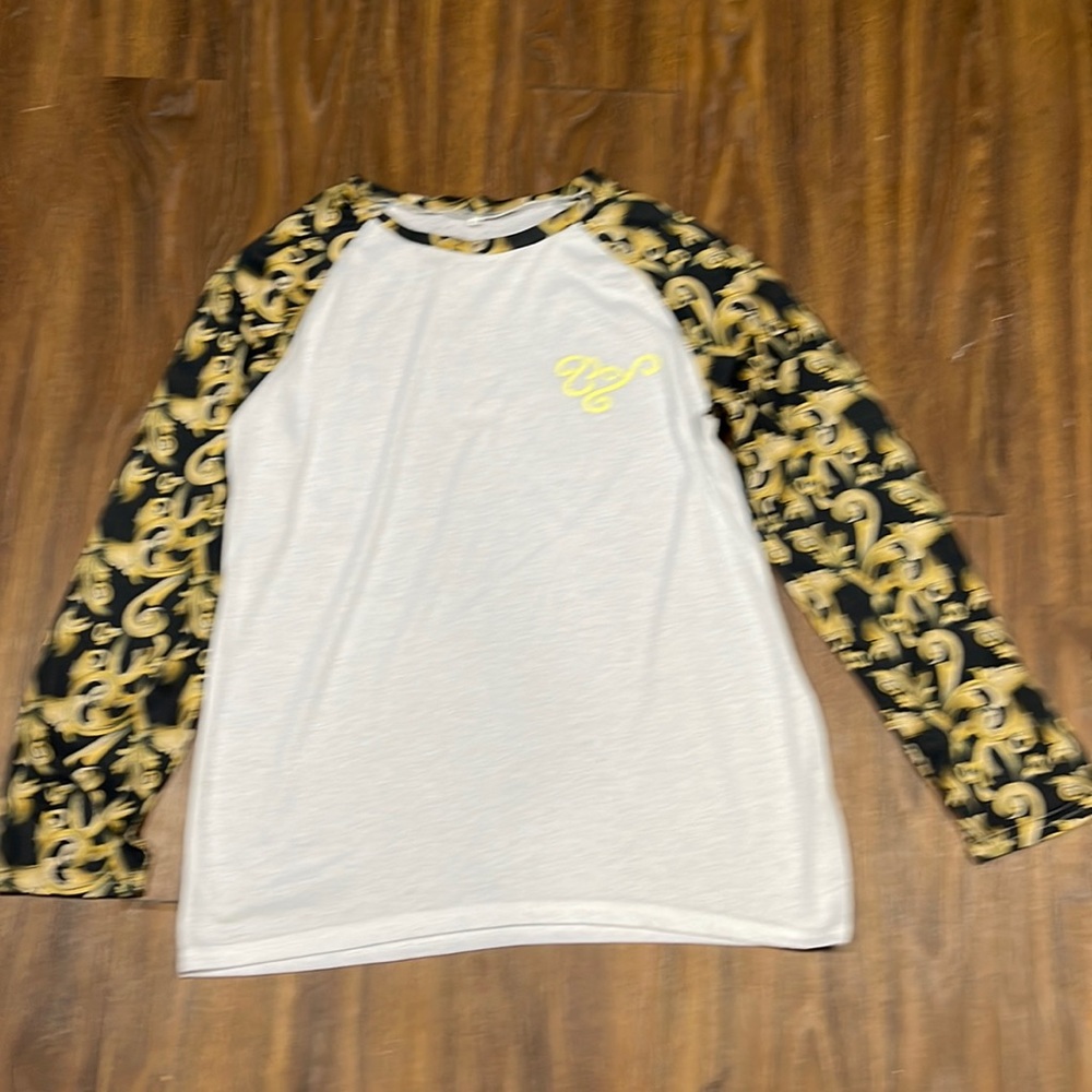 White- black with gold designs raglan xxl but fits like a large